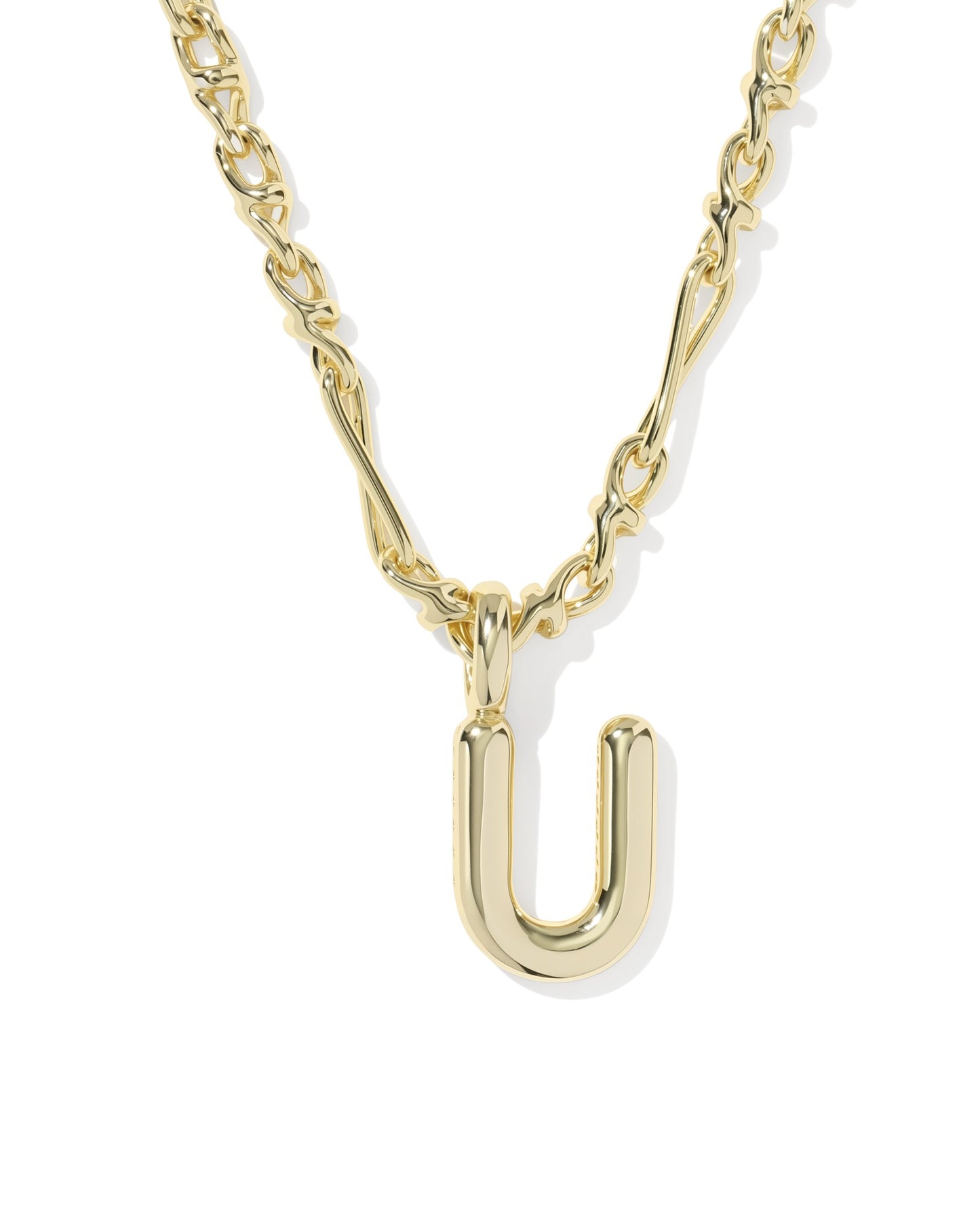 Gold necklace with a 'U' shaped pendant on a white background