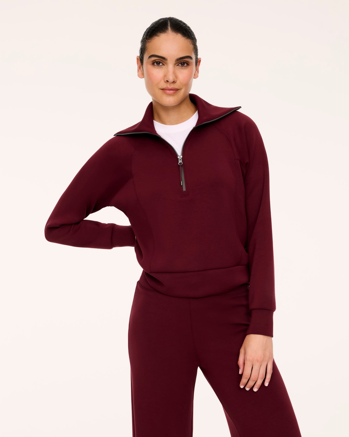 Woman in Spanx Vino Half-Zip Set with white background