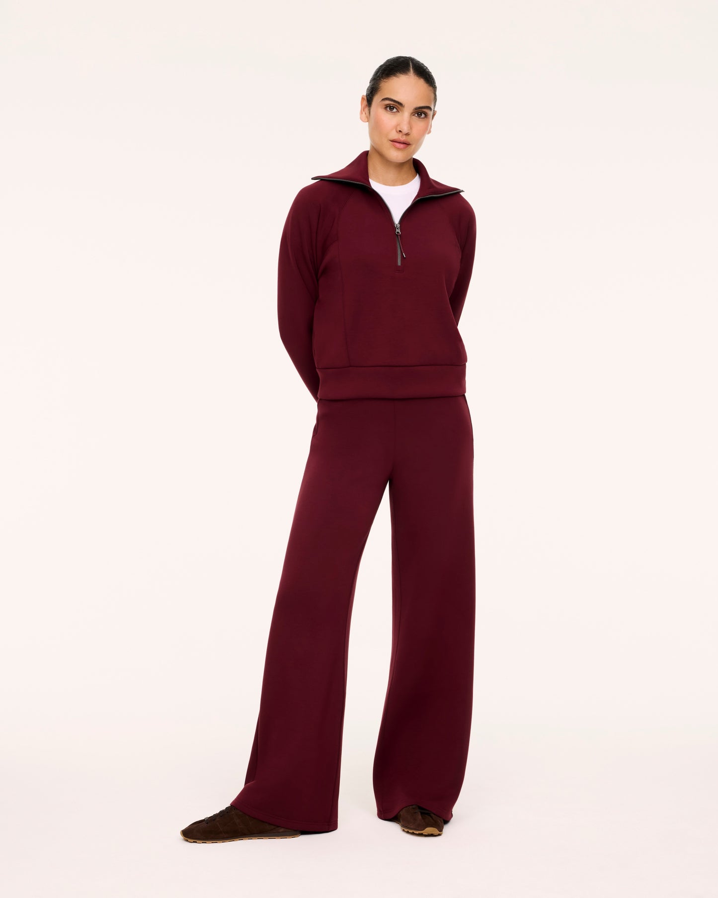 Woman in Spanx Vino Half-Zip Set with white background