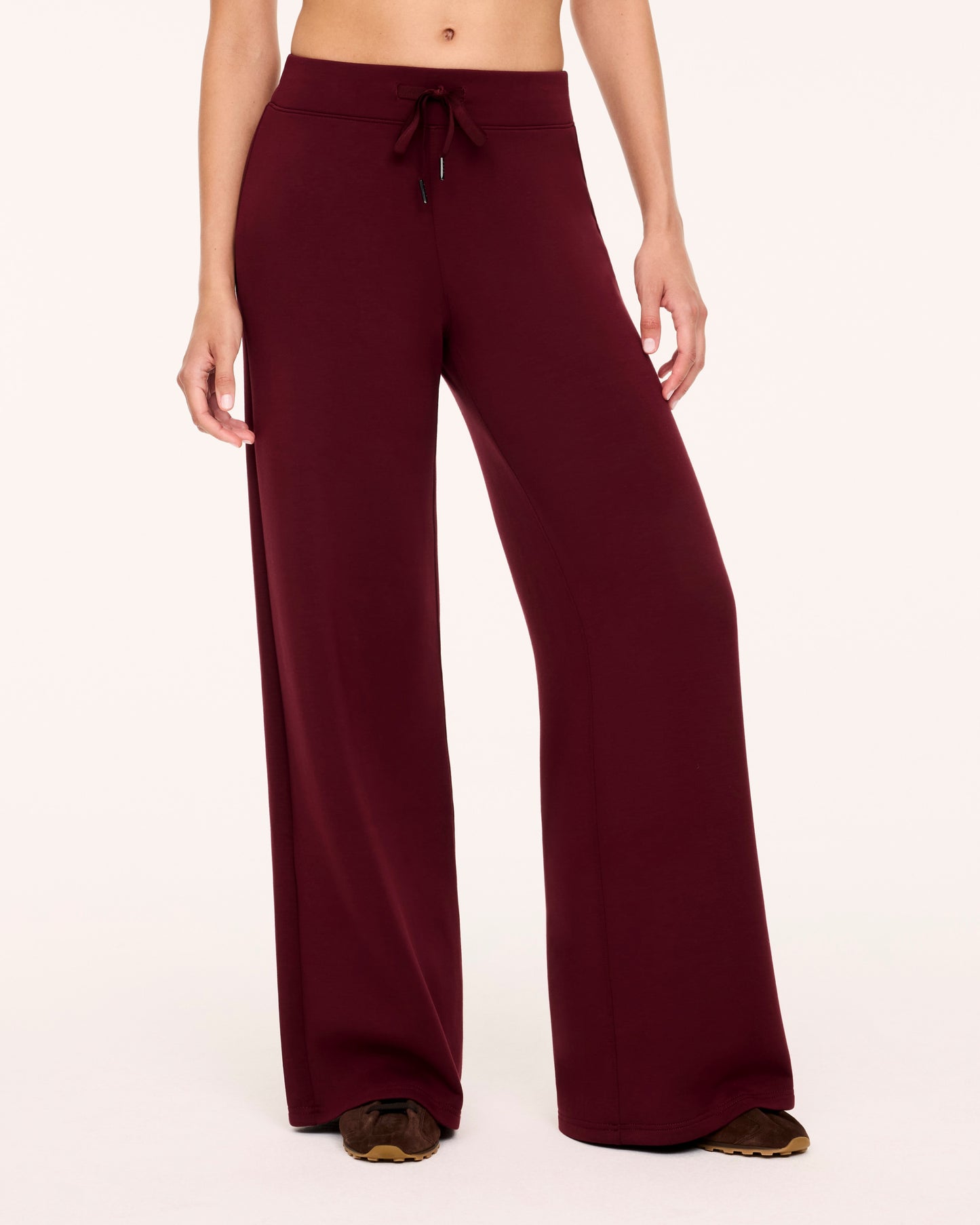 Woman in Spanx Vino Wide Leg Pants with white background