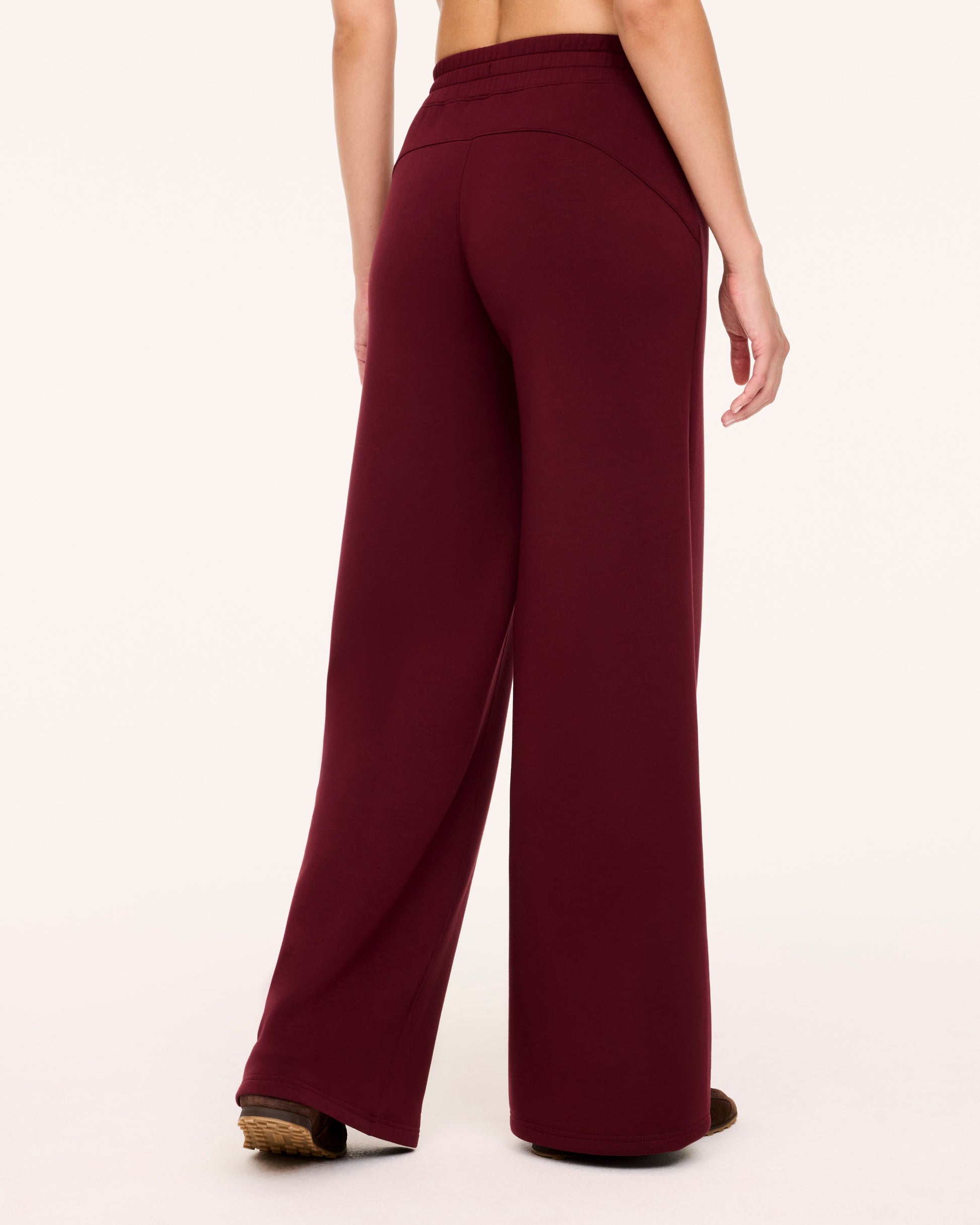 Back of woman in Spanx Vino Wide Leg Pants with white background