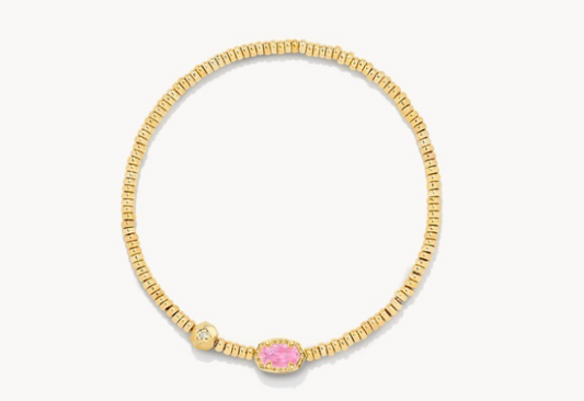 Gold bracelet with a pink gemstone on a white background