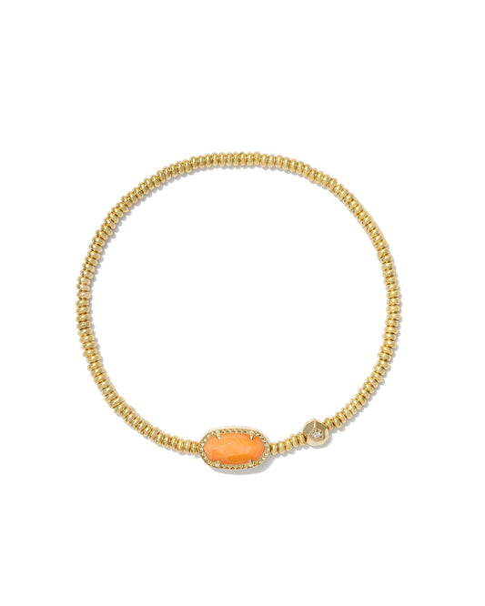A gold beaded chain bracelet featuring an oval orange stone centerpiece with a textured gold border, displayed on a clean white background.